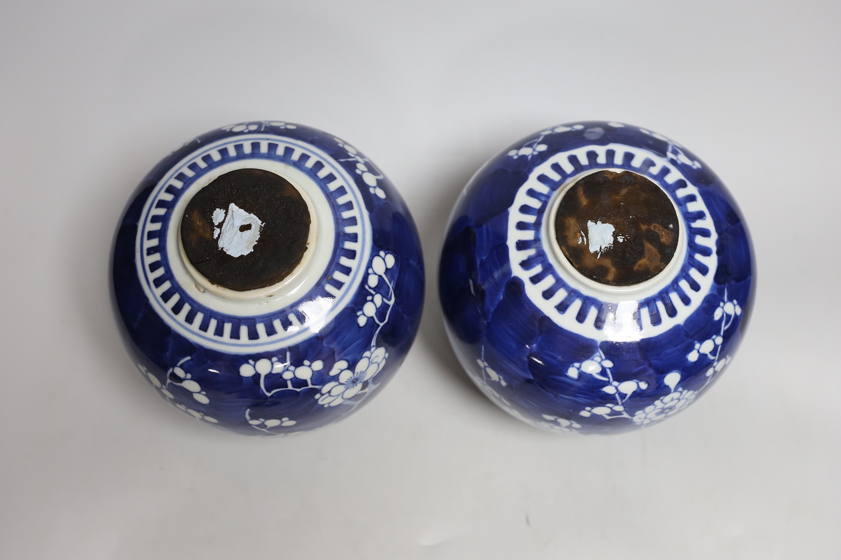 Two Chinese export porcelain Prunus blossom jars and covers, 20cms high